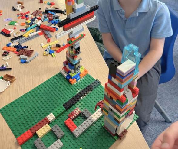 Children building creatively with LEGO